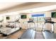 Community fitness center with treadmills with a view of the pool area to enjoy your workout at 2511 W Queen Creek Rd # 325, Chandler, AZ 85248