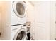 Convenient laundry area featuring stacked washer and dryer units, maximizing space in a functional design at 2511 W Queen Creek Rd # 325, Chandler, AZ 85248