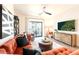 Cozy living room featuring a comfortable sofa, modern decor, and bright balcony access at 2511 W Queen Creek Rd # 325, Chandler, AZ 85248