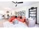 Inviting living room features an orange sectional sofa, stylish decor, and an open-concept design at 2511 W Queen Creek Rd # 325, Chandler, AZ 85248