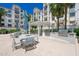 Community outdoor grilling area with multiple grills and dining tables, perfect for barbecues and gatherings at 2511 W Queen Creek Rd # 325, Chandler, AZ 85248