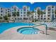 Beautiful pool with hot tub, luxurious lounge chairs and tables with a view of the elegant building at 2511 W Queen Creek Rd # 325, Chandler, AZ 85248