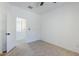 Bedroom with doorway leading to an adjacent room and neutral flooring at 2755 N 103Rd Ave, Avondale, AZ 85392