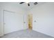 Bedroom with sliding closet doors and doorway leading to an adjacent room at 2755 N 103Rd Ave, Avondale, AZ 85392