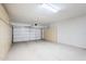 Spacious garage with built-in storage cabinets and an automatic door opener at 2755 N 103Rd Ave, Avondale, AZ 85392