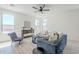 Bright and cozy living room with natural light, stylish furniture, and tile flooring at 2755 N 103Rd Ave, Avondale, AZ 85392