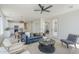 Inviting living room features a stylish blue sofa, neutral walls, and open layout at 2755 N 103Rd Ave, Avondale, AZ 85392
