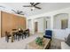 Cozy living room featuring wood-look accent wall, open archways, and comfortable seating arrangement at 2755 N 103Rd Ave, Avondale, AZ 85392
