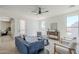 Bright living room featuring a ceiling fan, neutral paint, and comfortable seating arrangement at 2755 N 103Rd Ave, Avondale, AZ 85392