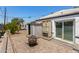 Inviting backyard patio with brick pavers, a shed, and overhead string lights at 2802 E Virginia Ave, Phoenix, AZ 85008