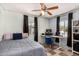 Guest bedroom features a work space with natural light and black out curtains at 2802 E Virginia Ave, Phoenix, AZ 85008