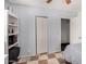 Spacious bedroom featuring a built-in bookcase and an open closet for storage at 2802 E Virginia Ave, Phoenix, AZ 85008