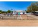 Charming home with red brick accents, white paint and a bright turquoise front door at 2802 E Virginia Ave, Phoenix, AZ 85008