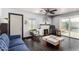 Cozy living room with fireplace, blue sofa, and hardwood floors and backyard access at 2802 E Virginia Ave, Phoenix, AZ 85008