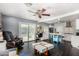 Open floor plan with kitchen access, stylish decor, hardwood floors and backyard access at 2802 E Virginia Ave, Phoenix, AZ 85008