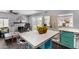Open concept layout from kitchen to living room space with plenty of natural light and backyard views at 2802 E Virginia Ave, Phoenix, AZ 85008