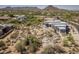 Stunning aerial view of a modern home with desert landscaping and mountain views in a beautiful Arizona setting at 28349 N 113Th St, Scottsdale, AZ 85262