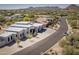 Aerial view of a contemporary home featuring a gray roof, xeriscaped front yard, and desert landscaping at 28349 N 113Th St, Scottsdale, AZ 85262