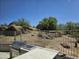 The backyard features an outdoor kitchen barbeque and beautiful desert landscape at 28349 N 113Th St, Scottsdale, AZ 85262