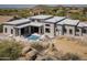 Aerial view of a backyard featuring a modern pool and patio area at 28349 N 113Th St, Scottsdale, AZ 85262