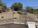 The backyard features beautiful desert landscape with view of rocks and trees at 28349 N 113Th St, Scottsdale, AZ 85262