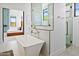 Modern bathroom with a freestanding tub and an open view of the bedroom at 28349 N 113Th St, Scottsdale, AZ 85262