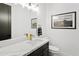 Elegant powder bathroom with a marble countertop, gold fixtures, and a modern design at 28349 N 113Th St, Scottsdale, AZ 85262