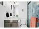 Well-lit bathroom features a marble countertop, a framed mirror, a toilet, and a glass enclosed shower at 28349 N 113Th St, Scottsdale, AZ 85262
