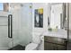 Modern bathroom with glass shower, decorative art, and sleek fixtures at 28349 N 113Th St, Scottsdale, AZ 85262