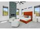 Well-lit bedroom featuring a modern fireplace, large windows, and comfortable seating at 28349 N 113Th St, Scottsdale, AZ 85262