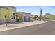 Contemporary home featuring a xeriscaped front yard and attractive garage doors at 28349 N 113Th St, Scottsdale, AZ 85262