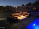 Backyard fire pit and seating area with desert views, perfect for enjoying the outdoors at 28349 N 113Th St, Scottsdale, AZ 85262