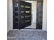 A contemporary front door with glass panels and stone pavers leading to the entrance at 28349 N 113Th St, Scottsdale, AZ 85262