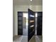 A modern front door with side panels lets in natural light, welcoming you into the home at 28349 N 113Th St, Scottsdale, AZ 85262