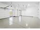 Spacious and well-lit three car garage with epoxy floor at 28349 N 113Th St, Scottsdale, AZ 85262