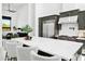 Modern kitchen with a spacious island, sleek appliances, and open layout connecting seamlessly to the living area at 28349 N 113Th St, Scottsdale, AZ 85262