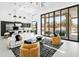Bright, open living room featuring high ceilings, modern furnishings, and a seamless indoor/outdoor transition with pool views at 28349 N 113Th St, Scottsdale, AZ 85262