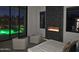 Bedroom featuring electric fireplace, outside views and decor elements and pool view at night at 28349 N 113Th St, Scottsdale, AZ 85262