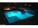 Backyard swimming pool with waterfall feature and a cozy fire pit lounge area at 28349 N 113Th St, Scottsdale, AZ 85262