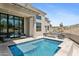 Luxurious outdoor pool area with desert landscaping and multiple seating areas at 28349 N 113Th St, Scottsdale, AZ 85262