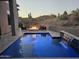 Relaxing pool area with a fire pit and scenic desert landscape views at 28349 N 113Th St, Scottsdale, AZ 85262