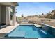Backyard pool has desert views, an integrated waterfall feature, and a built-in fire pit at 28349 N 113Th St, Scottsdale, AZ 85262