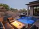 Inviting pool with a fire pit and seating area, perfect for outdoor entertaining at 28349 N 113Th St, Scottsdale, AZ 85262