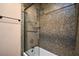 Bathroom featuring beautiful multi-colored mosaic tile surround on the bathtub and shower at 31721 N 138Th Pl, Scottsdale, AZ 85262
