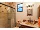 Charming bathroom with tiled shower, sink and mirror plus window for natural light at 31721 N 138Th Pl, Scottsdale, AZ 85262