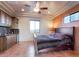 Bedroom featuring a kitchenette, ceiling fan, and natural light at 31721 N 138Th Pl, Scottsdale, AZ 85262