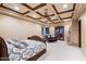 Spacious primary bedroom with a decorative ceiling and a cozy seating area at 31721 N 138Th Pl, Scottsdale, AZ 85262