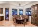 Charming breakfast nook with backyard views, wood cabinets, and a decorative chandelier for cozy dining at 31721 N 138Th Pl, Scottsdale, AZ 85262