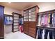 Walk-in closet with custom built-in shelving and ample storage space at 31721 N 138Th Pl, Scottsdale, AZ 85262