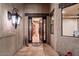 Elegant foyer with tile flooring, decorative lighting, and an ornate front door providing a grand entrance at 31721 N 138Th Pl, Scottsdale, AZ 85262